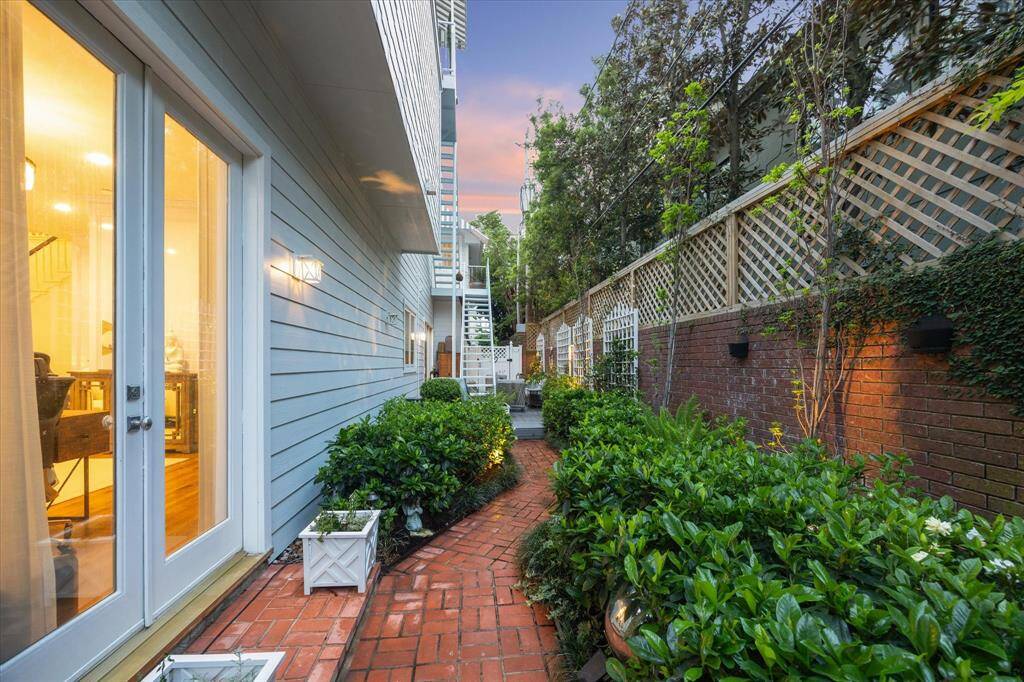 After the fire you can retrieve to the secondary outside entertaining area as you stroll past fragrant Gardenias and additional plantings.