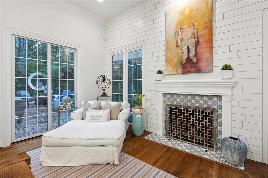 Sliding door leads to backyard area, perfect for a large pool.  Detailed custom stone fireplace surround and hearth.
