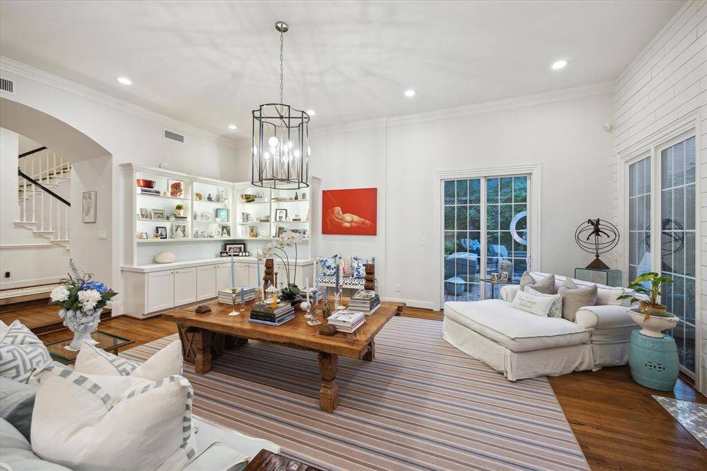 Another profile from the corner showing the size of the room and beautiful exterior space, high ceiling's and visual to front hallway and entry.