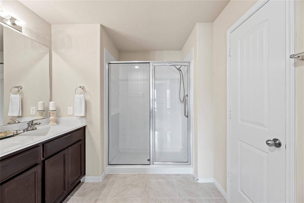 Dual vanities in your en-suite primary bath, offer personal space with tons of dedicated cabinet space.