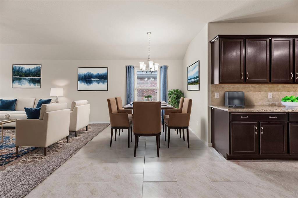 In this open concept design, the kitchen serves as the heart of the home, where meals are prepared, conversations flow, and memories are made. With the dining area nearby, it's easy for family members to enjoy casual meals together or for guests to chat with the cook while meals are being prepared.