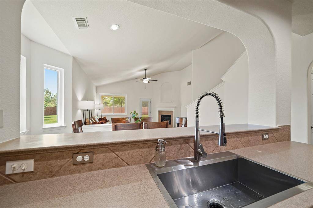 A view of the formal dining room & living room from the kitchen.