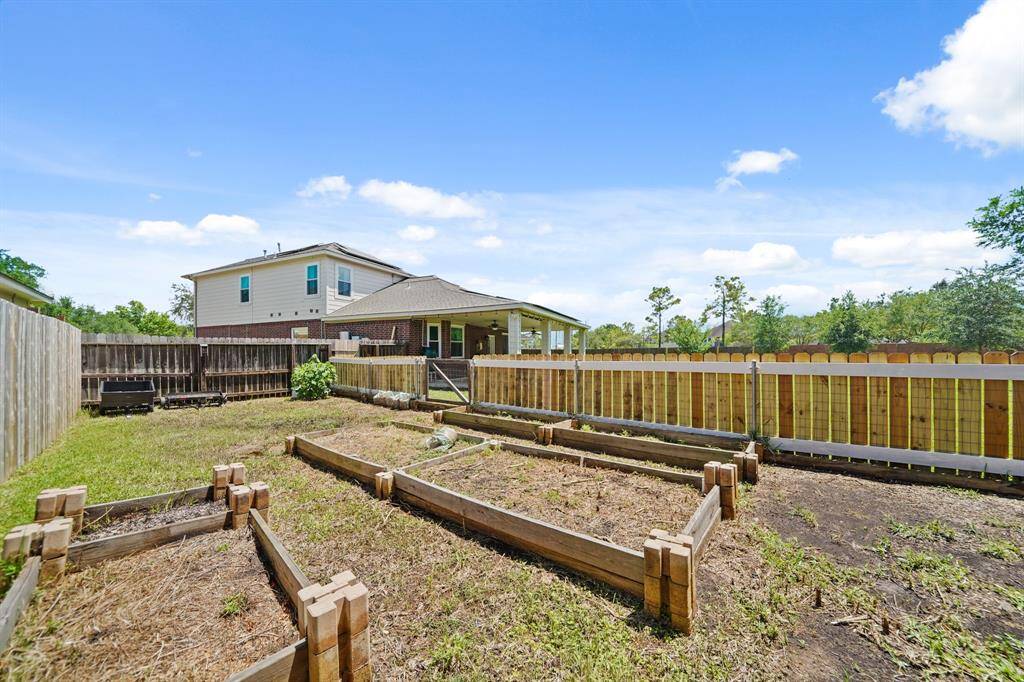 Try your hand at gardening with this separately fenced garden area. A rainwater harvesting barrel is included.