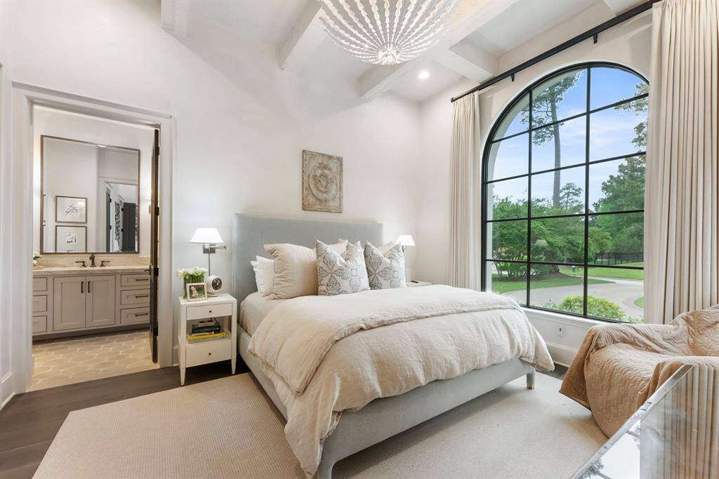Perfect for guests or multi-generational living, a first-floor secondary bedroom offers privacy and comfort with its own en-suite bath.