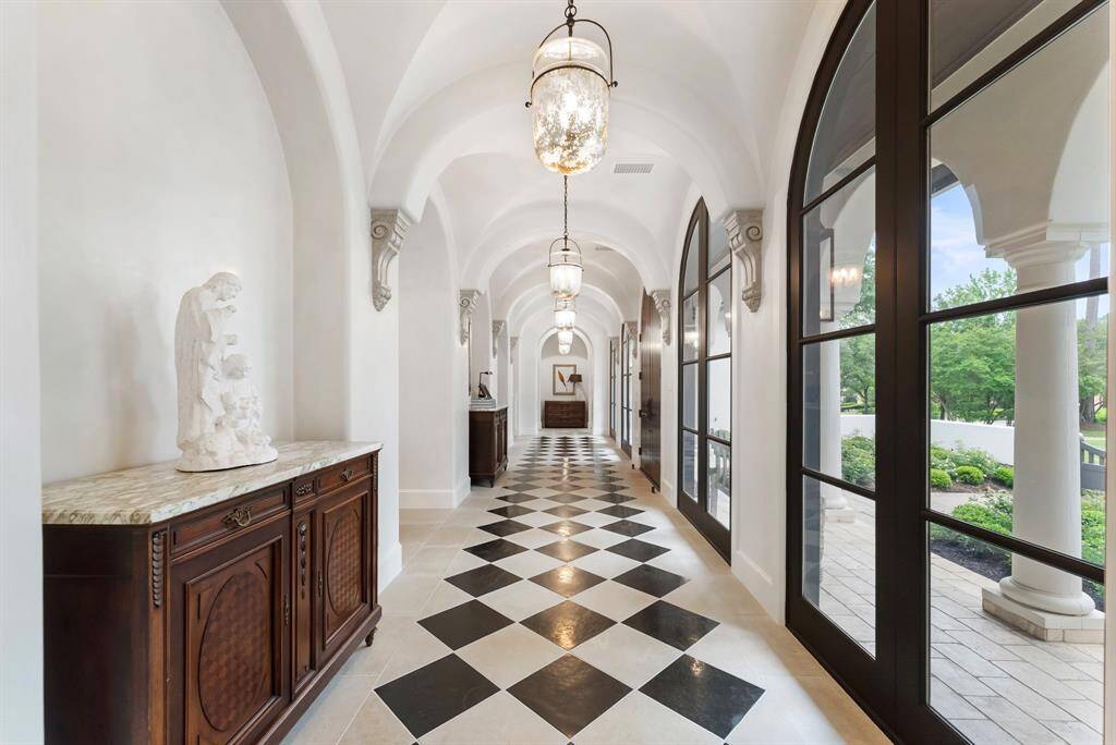 Graceful arched ceilings add architectural charm and continuity to the design