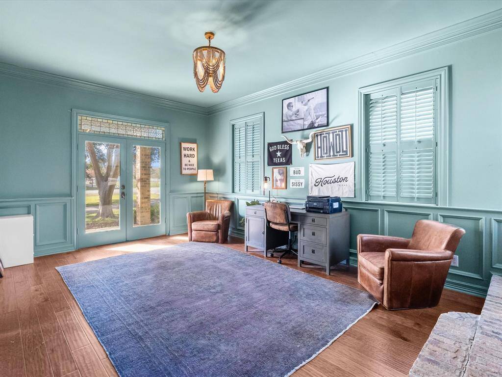 The home features a spacious office with a fireplace, conveniently located just off the foyer, offering both elegance and functionality.
