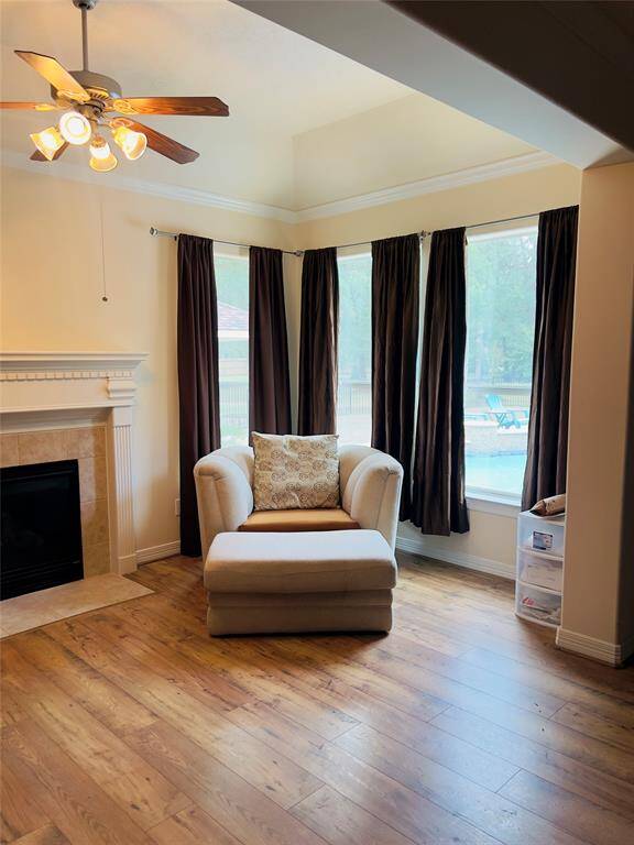 Owner's Retreat features fireplace and large seating area that overlooks massive backyard with beautiful pool.