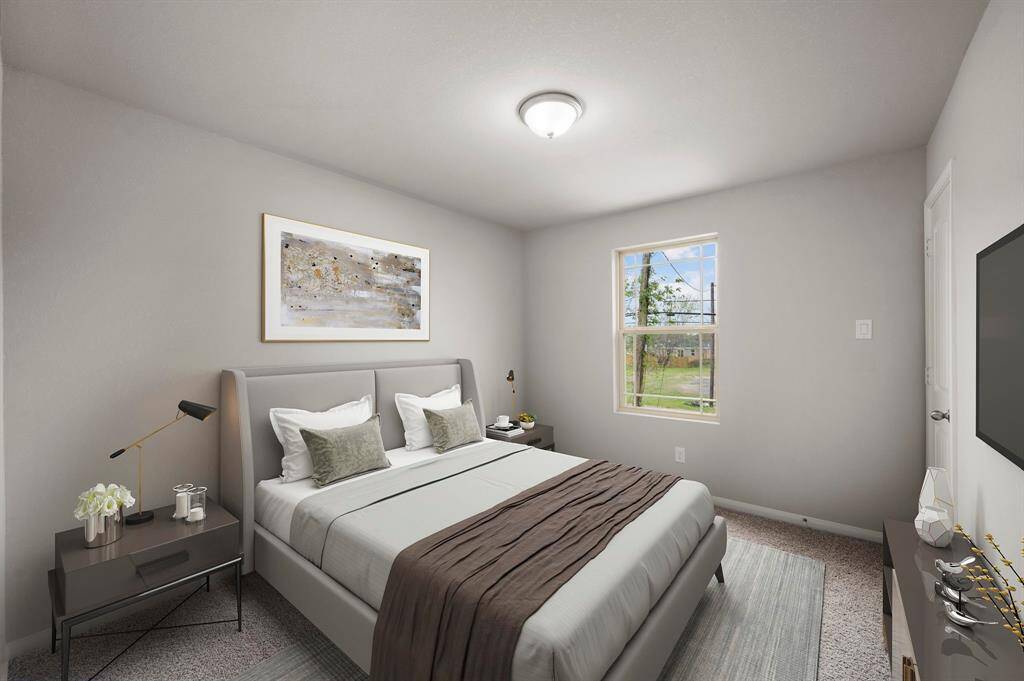 STAGED 3rd bedroom with carpet and dimensions of approximately 10'-0" x 11'-6"