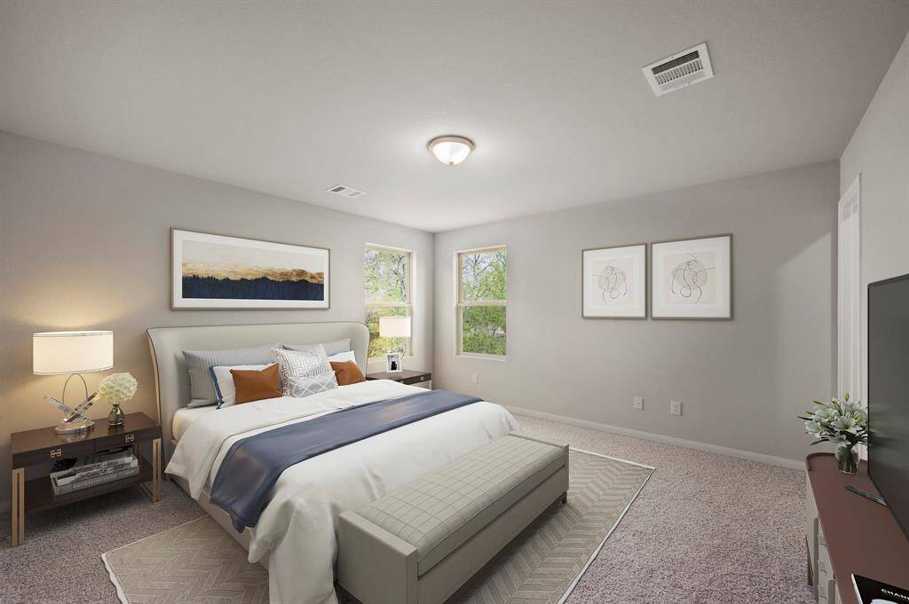 STAGED master bedroom with carpet flooring and dimensions of approximately 17'-0" x 13'-7"