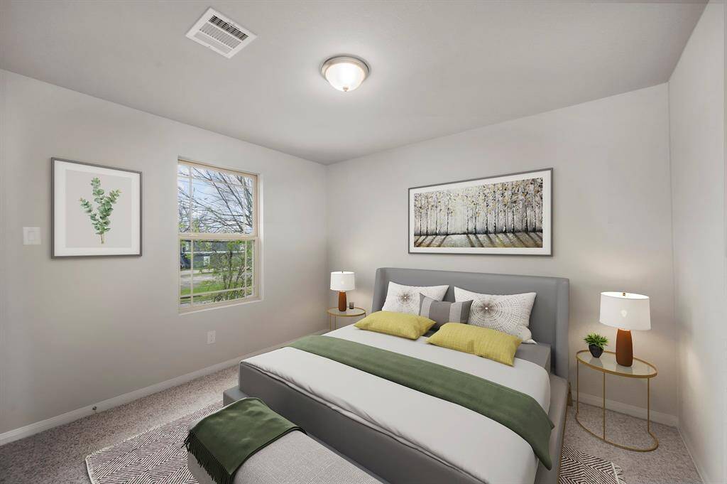 STAGED 2nd bedroom with carper and dimensions of approximately 9'-1" x 10'-6"