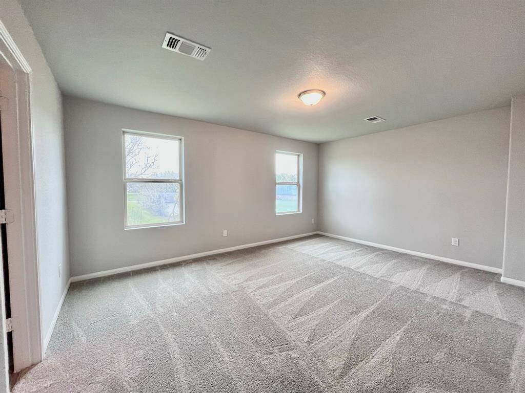 STAGED bedroom upstairs with carpet