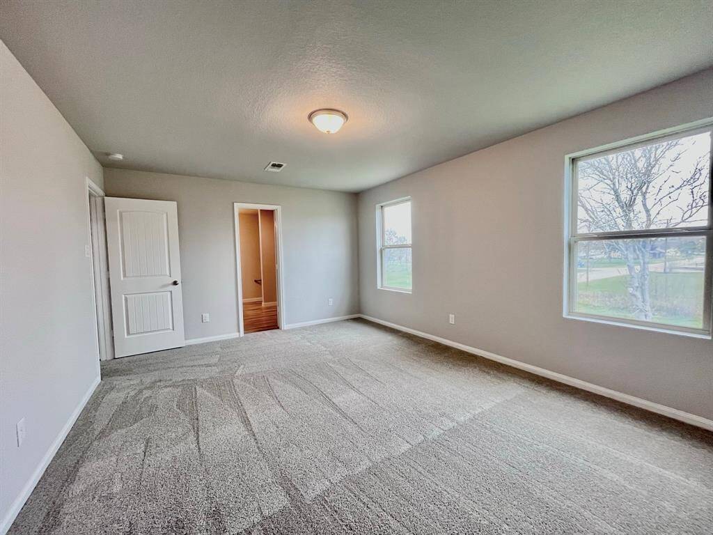 STAGED master bedroom upstairs with carpet