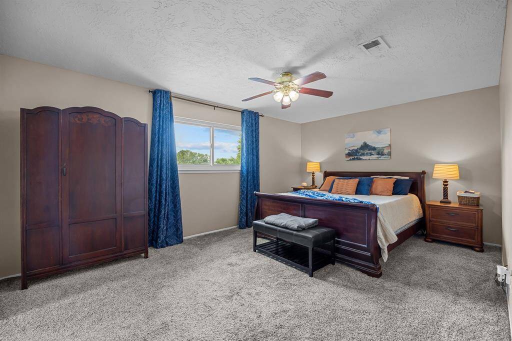 Primary Bedroom with ceiling fan