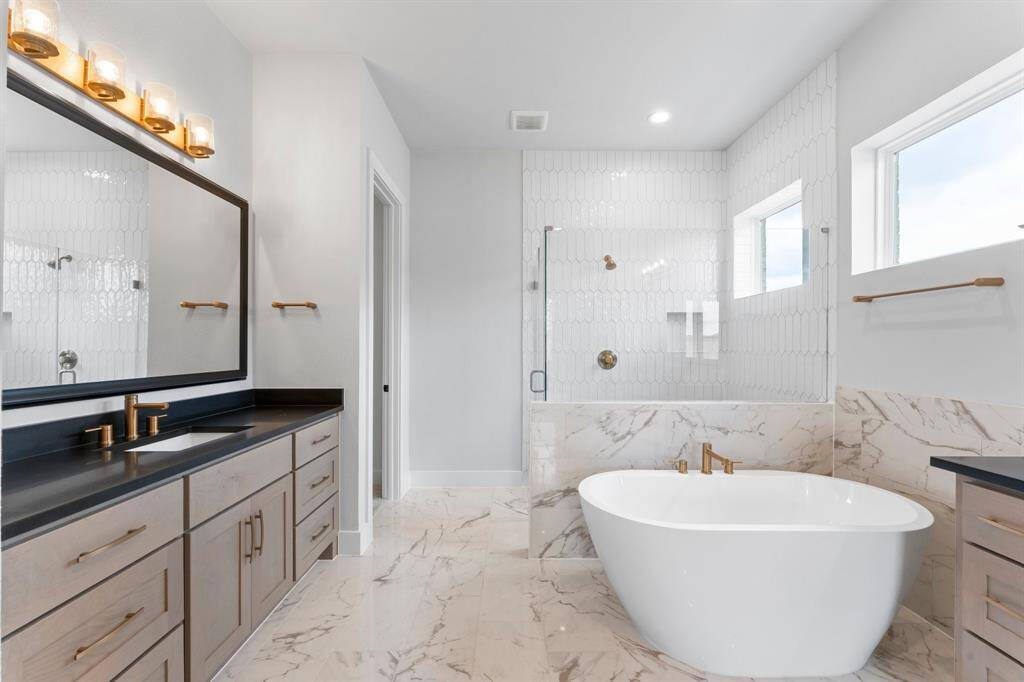 Primary Bath with Separate Vanities and Freestanding Tub