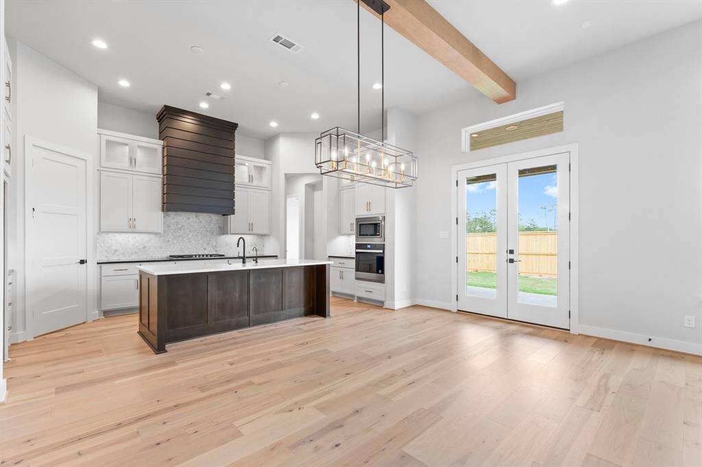 Dining with Access to the Covered Rear Patio and Open to the Kitchen and Family Room