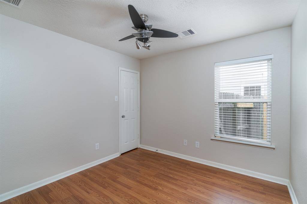 Bedroom 3 w/ laminate floors, ceiling fan and generous size closet.