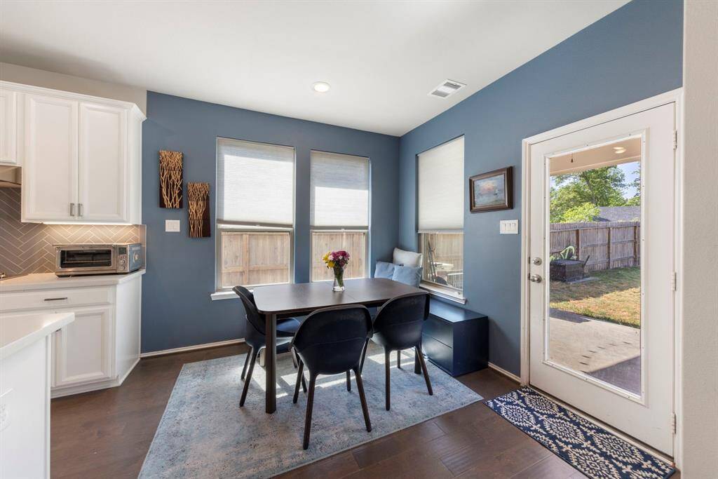 Breakfast nook off the kitchen with access to the back patio.