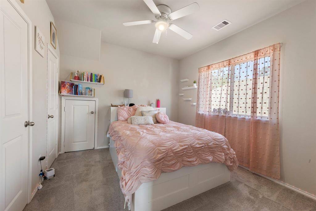 Three secondary bedrooms upstairs, all with carpet, ceiling fans, windows and closets.