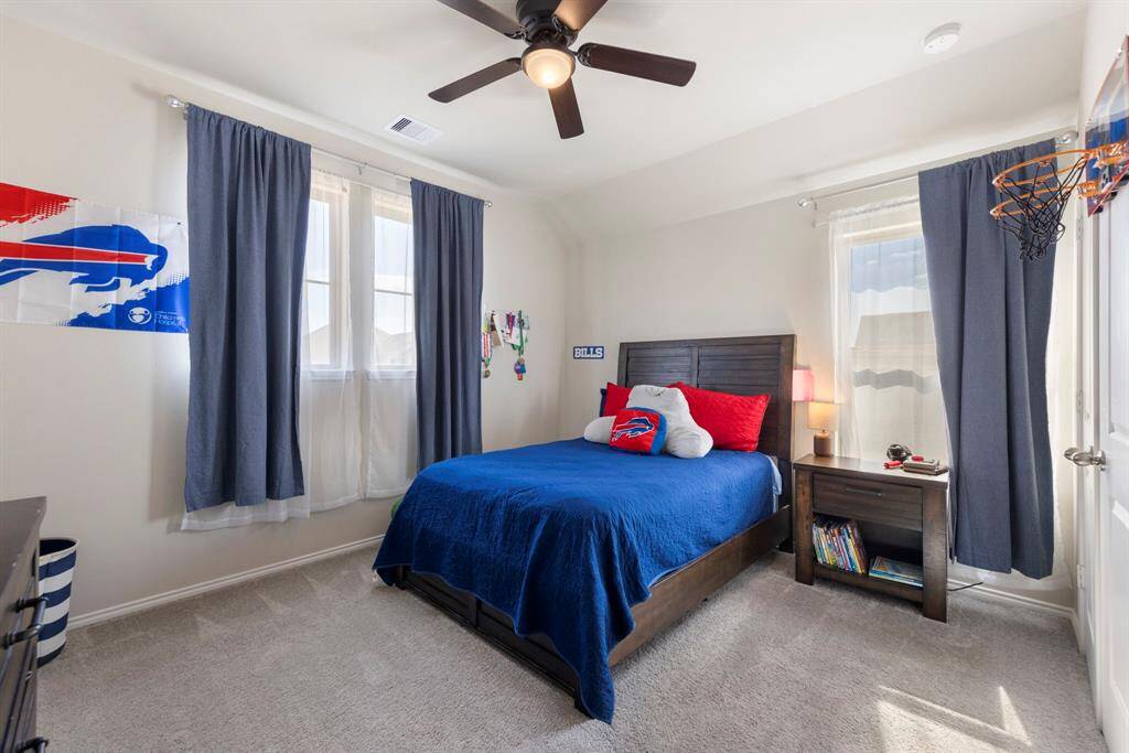 Three secondary bedrooms upstairs, all with carpet, ceiling fans, windows and closets.