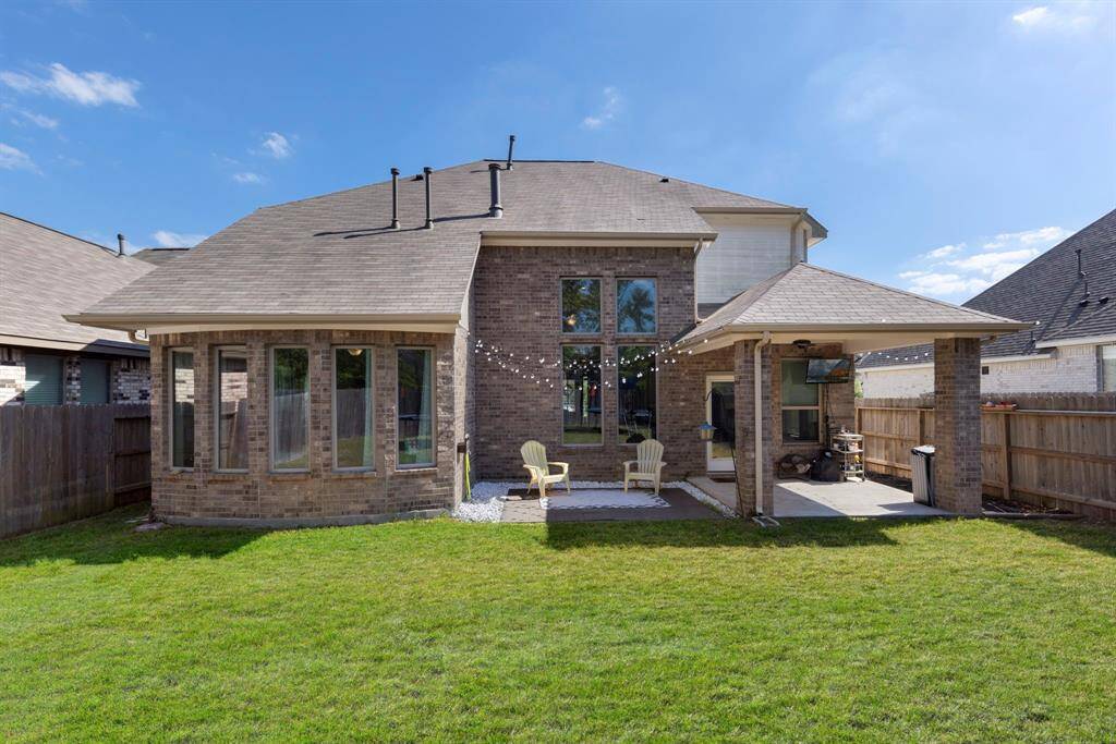 The home boasts a stunning 4-sided brick exterior, complete with gutters for added convenience.