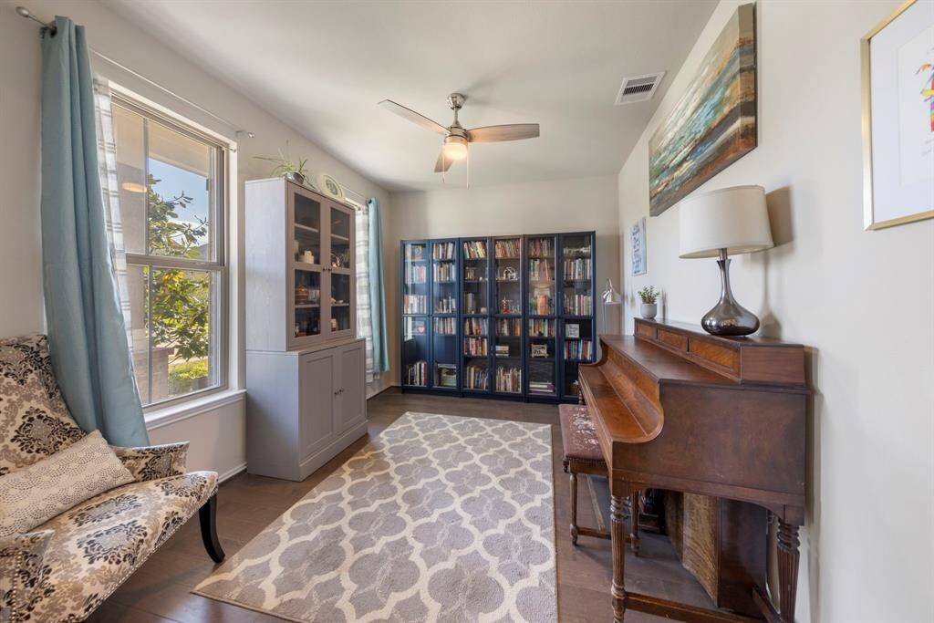 Just off the entry, a versatile flex room awaits—ideal for a home office, playroom, or formal dining space.