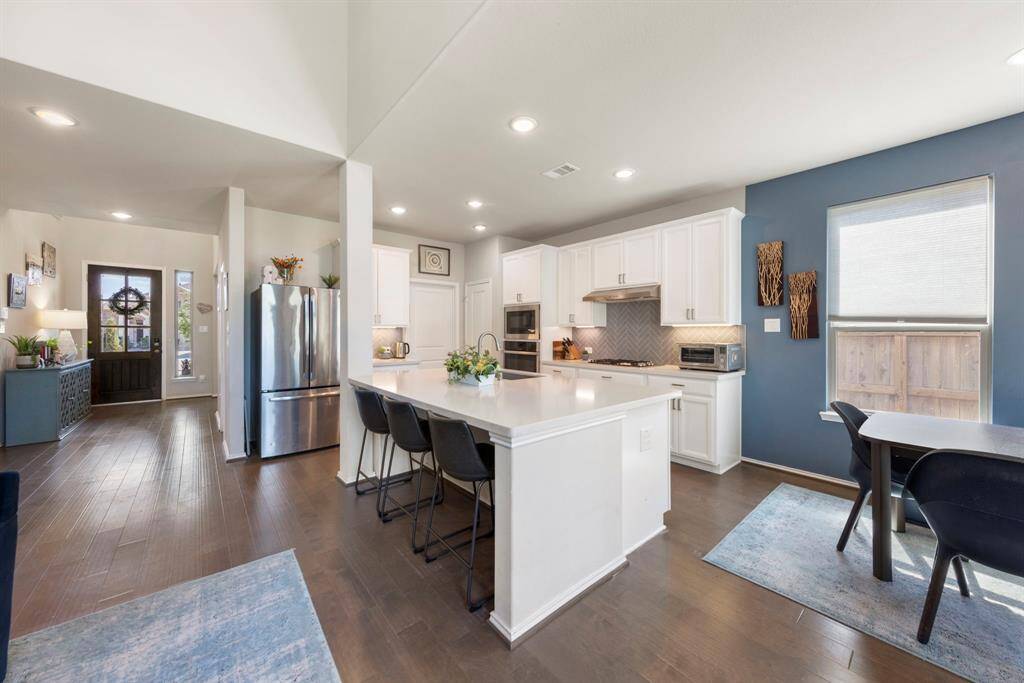 Just off the kitchen, the utility room offers added convenience with a built-in storage system.
