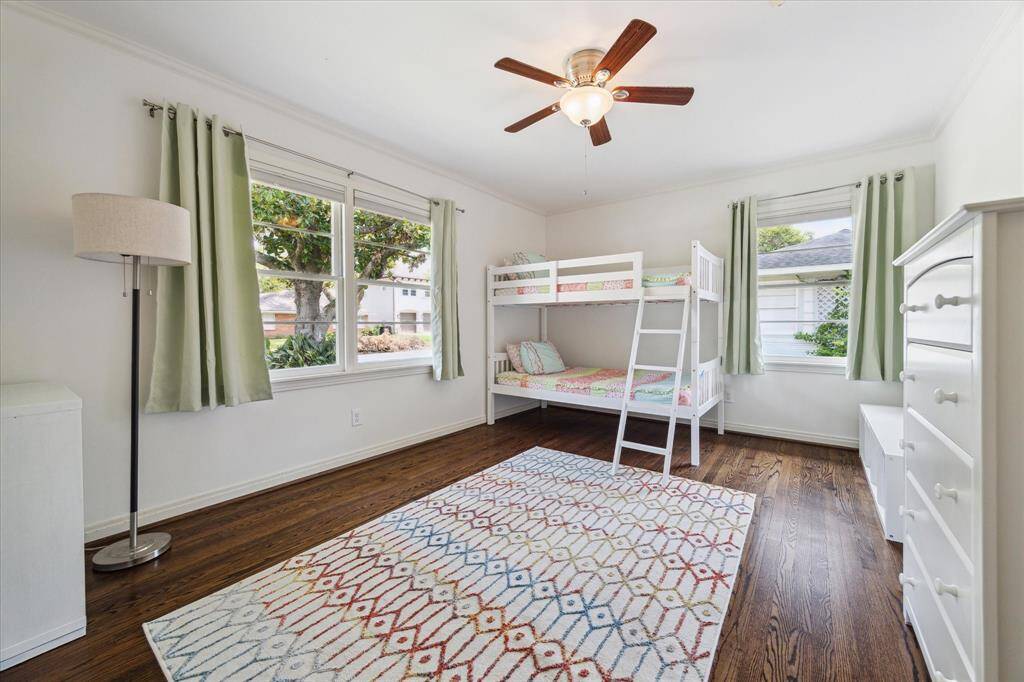 Secondary bedroom overlooking the front yard. Spacious and light filled