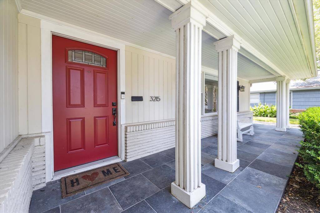 Welcoming front entrance and lovely covered porch
