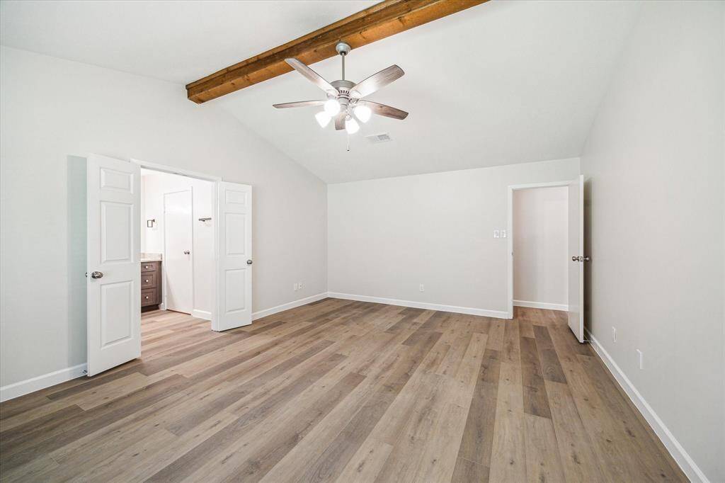 Double doors lead to the primary bathroom