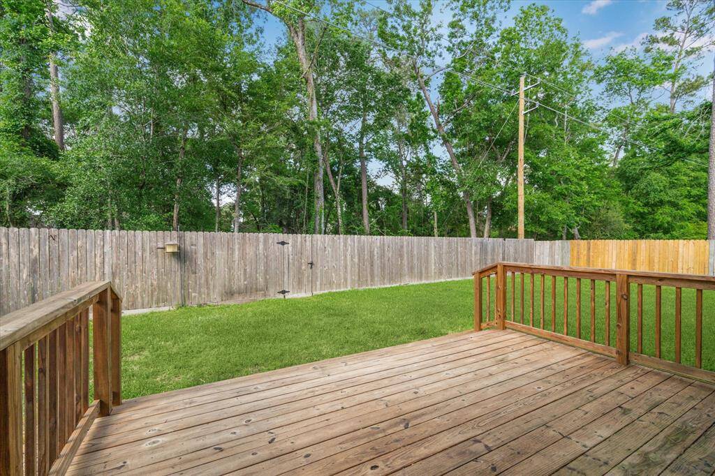 Wood deck off of back patio and NO back neighbors!