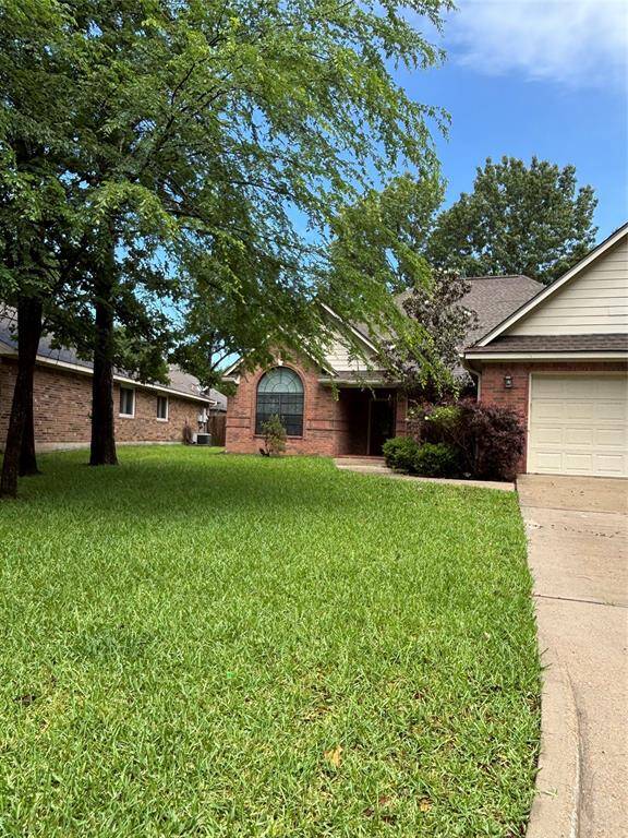 Charming brick home with a well-maintained lawn, mature trees, and a welcoming front entrance. Features a two-car garage and a spacious driveway. Ideal for a cozy, suburban lifestyle.