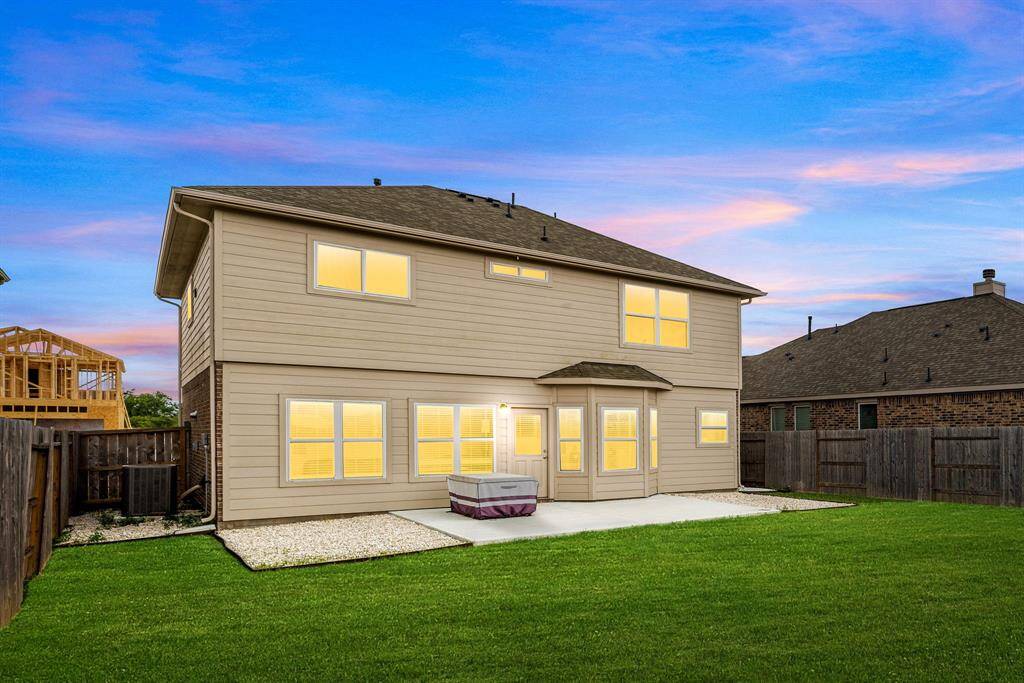 Spacious and private! This fully fenced backyard offers an expansive green space perfect for outdoor living, pets, and play.