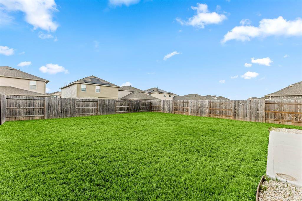 Enjoy peace, privacy, and potential in this generous backyard retreat, ideal for entertaining, relaxing, or future additions.