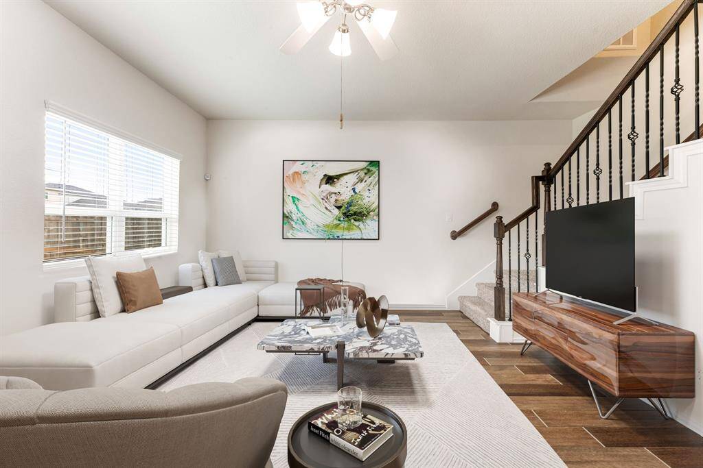 Gather the family and guests together in your lovely living room! Featuring soaring high ceilings, custom paint, gorgeous wood style floors and large windows that provide plenty of natural lighting throughout the day. *Virtually Staged