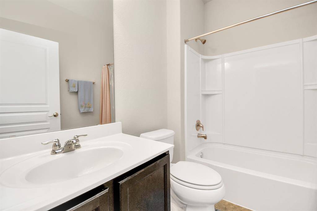 The full second bathroom features a tub/shower combination