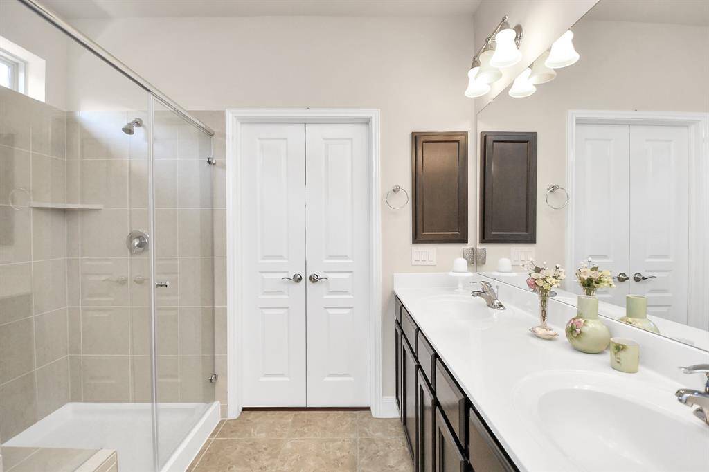 Double doors lead to the spacious Primary bedroom