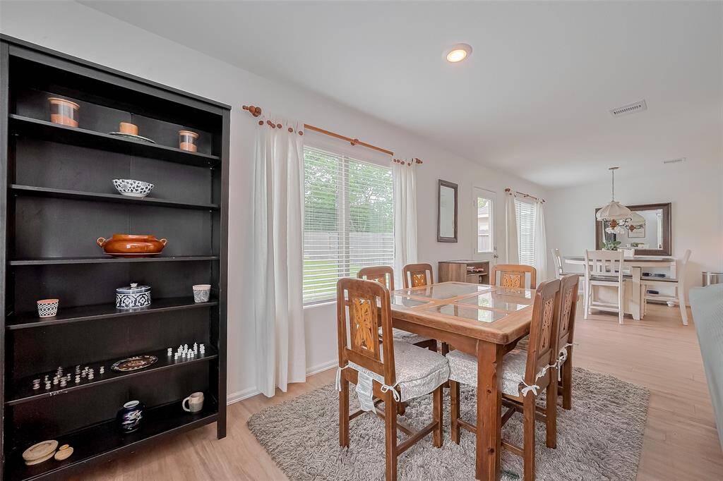 Large windows that fill the space with natural light and offer lovely outdoor views.
