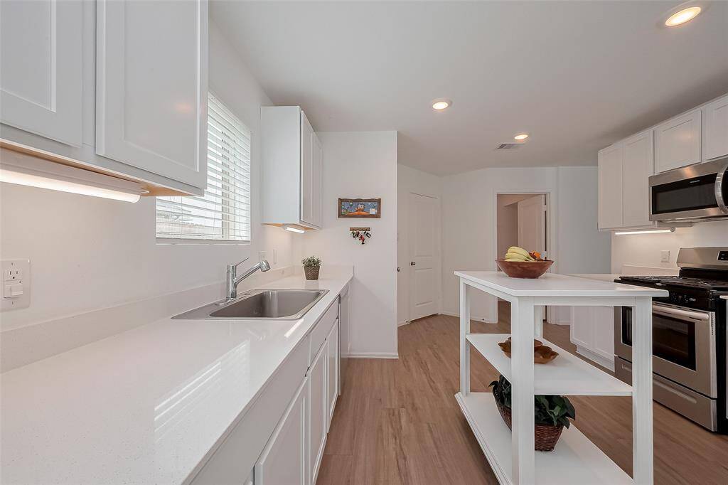Abundant natural light fills the kitchen, creating a bright and welcoming space.