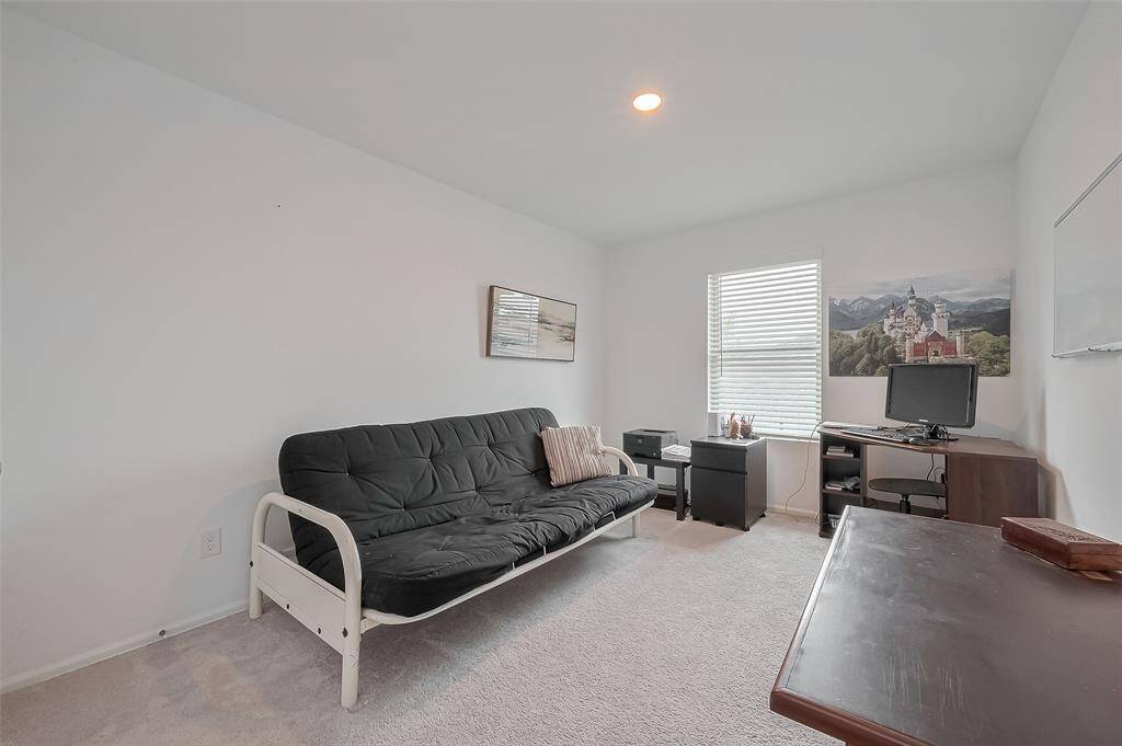 First secondary bedroom with natural light — ideal for guests or family.
