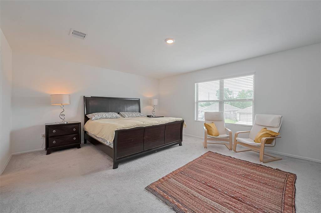 Generously sized primary suite designed for comfort and tranquility.