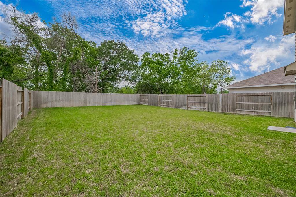 Expansive backyard offering endless potential for beautiful outdoor living projects.