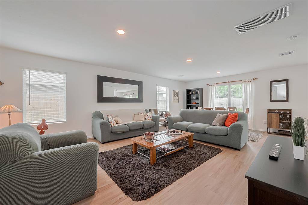 Spacious family room filled with natural light — perfect for relaxing or entertaining