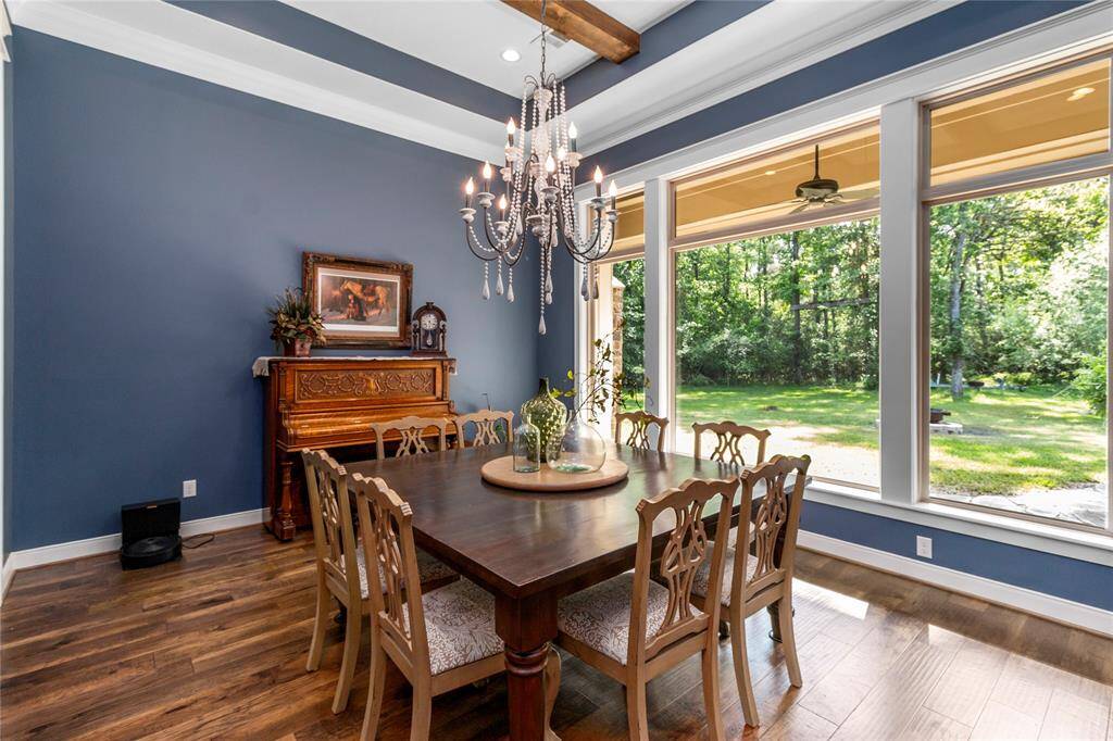 Spacious formal dining room with stunning wall of windows.