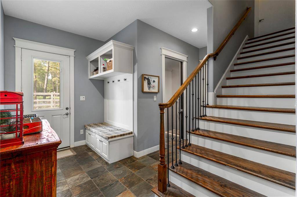 Entry from driveway and garage that leads to back door of pantry for easy unloading and putting away of groceries. Stairway leads to HUGE unfinished space above the garage.