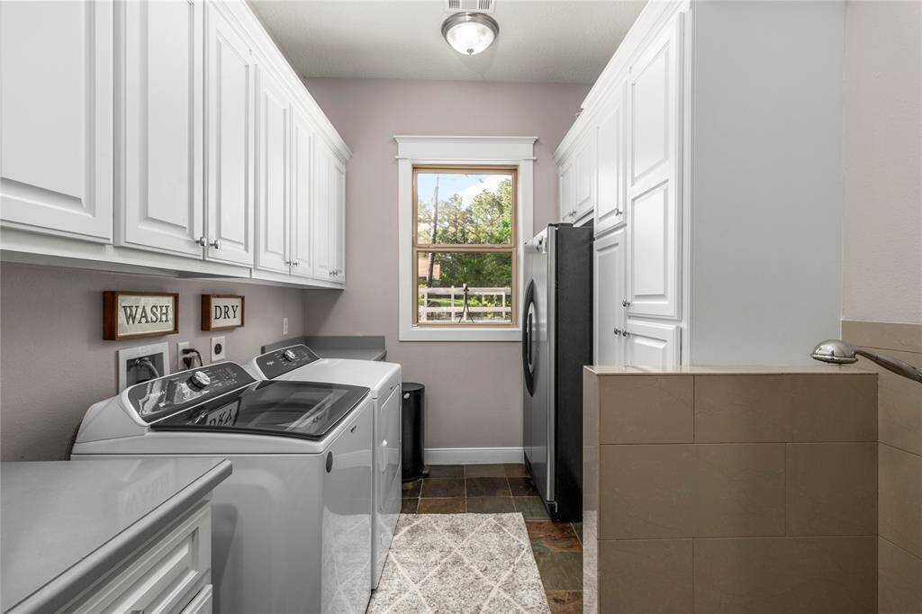 Laundry room, complete with dog wash station.