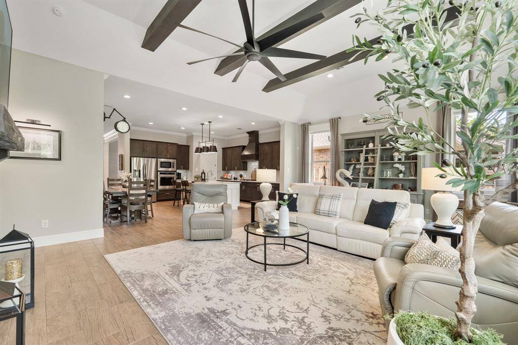 Sky high ceilings, mixed with stylish architectural details and soothing hues transform this home into the warm and inviting space you see here.
