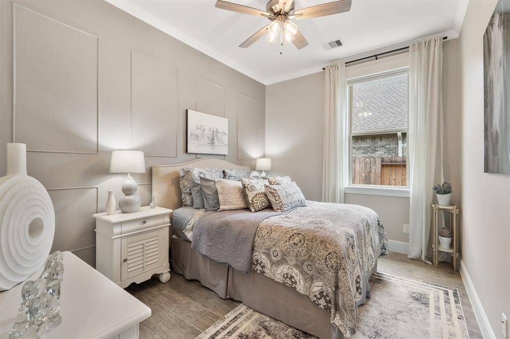 This third Bedroom boasts all the same features as the prior Bedroom, only this one has a framed accent wall in a warm and sandy hue.