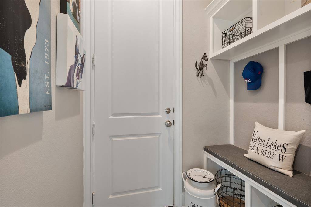 Upon entering the house from the Garage, this built-in storage unit is ready and waiting to catch your keys, coats, and backpacks for safe keeping.