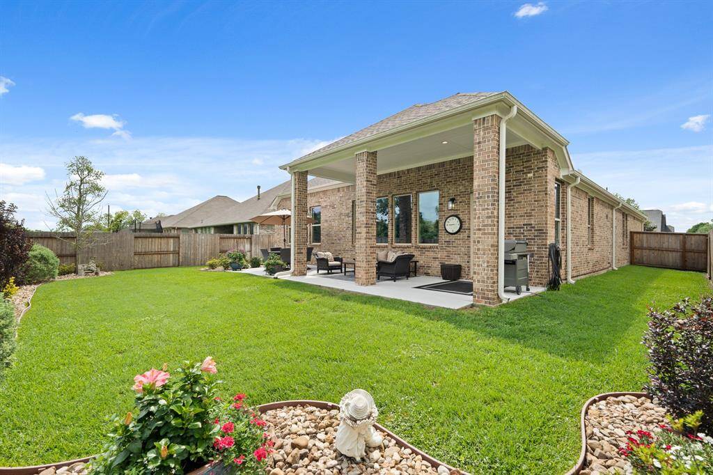 The lush, green Backyard continues around towards an equally spacious Side Yard. There is plenty of room to add a small pool, playground, and/or raised garden beds. Do you have a green thumb?