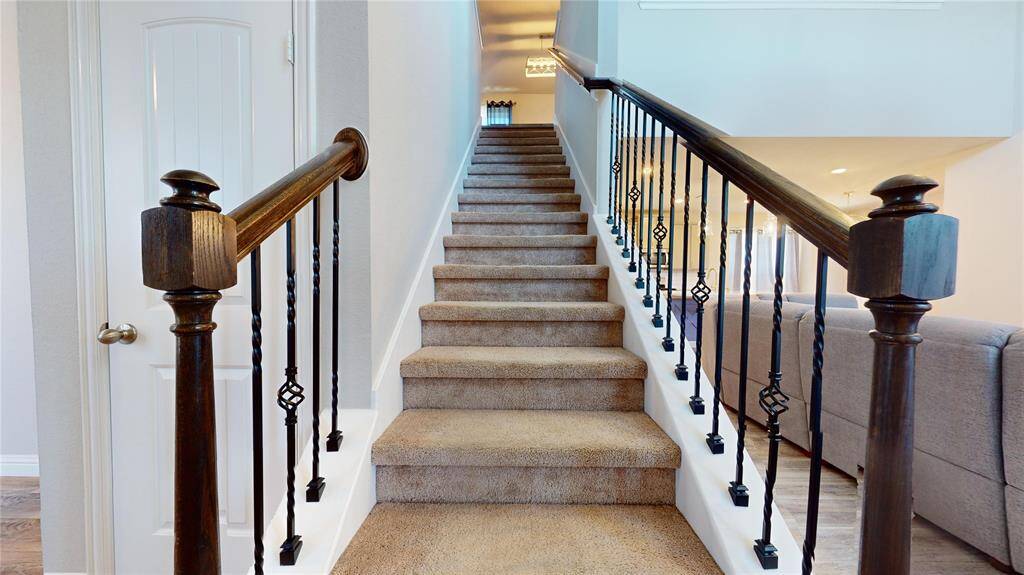 Elegant staircase leading to a spacious second floor.